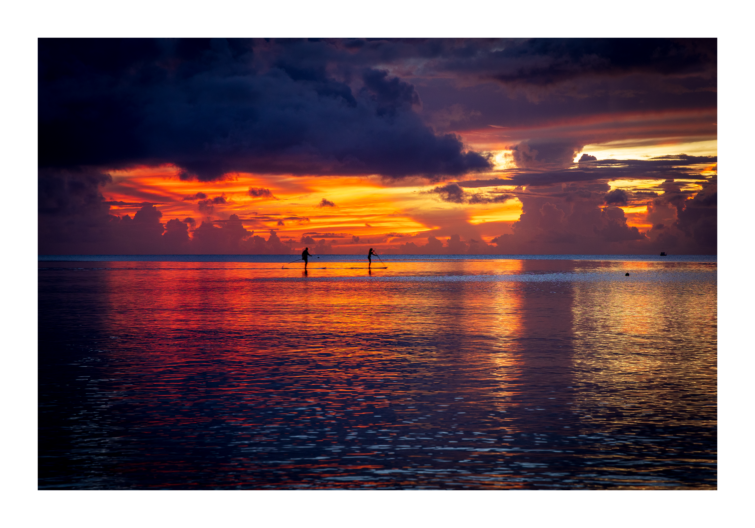 The 18x12 Tumon Bay Sunset fine art print, shown with an elegant white border and ready for framing.