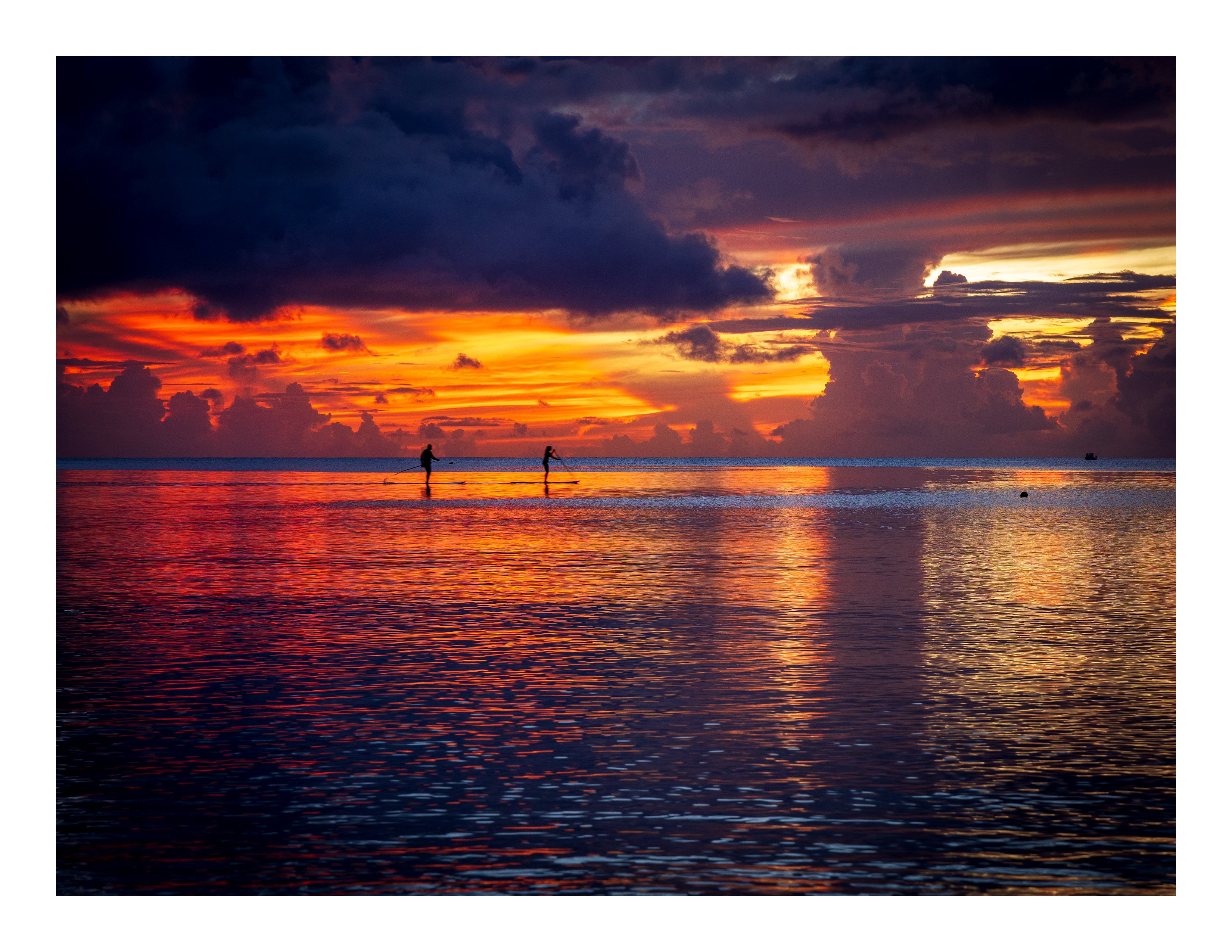 The 22x17 Tumon Bay Sunset fine art print, shown with an elegant white border and ready for framing.