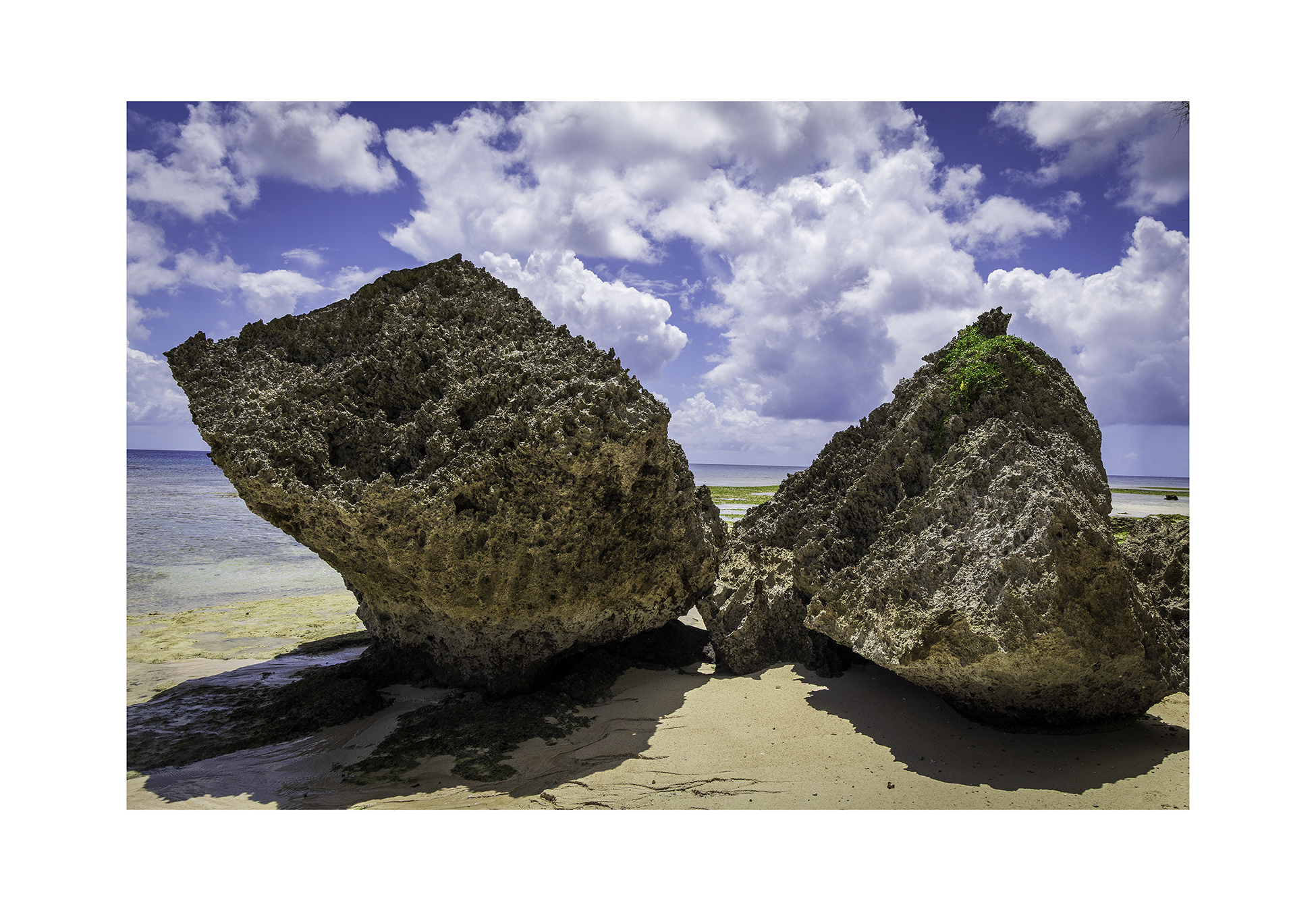 The 12x8 Gun Beach Rocks fine art print, shown with an elegant white border and ready for framing.