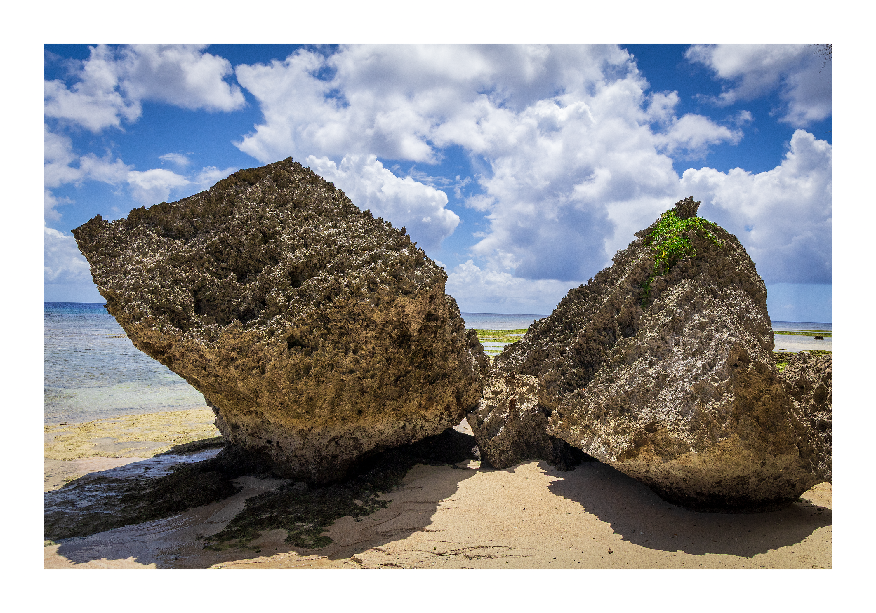 The 18x12 Gun Beach Rocks fine art print, shown with an elegant white border and ready for framing.