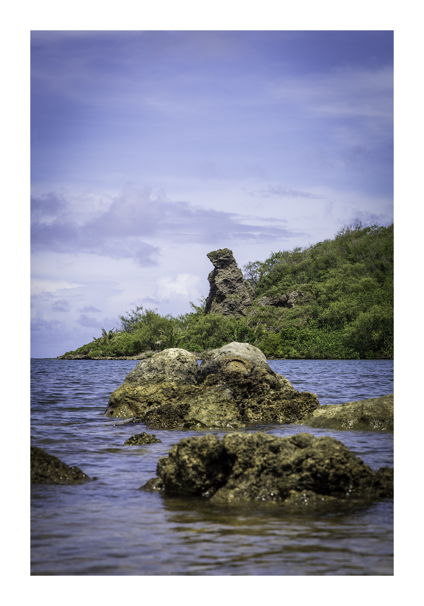 A 12x18 inch fine art coastal photography print of Bear Rock in Guam, showing product dimensions and clean white border margins.