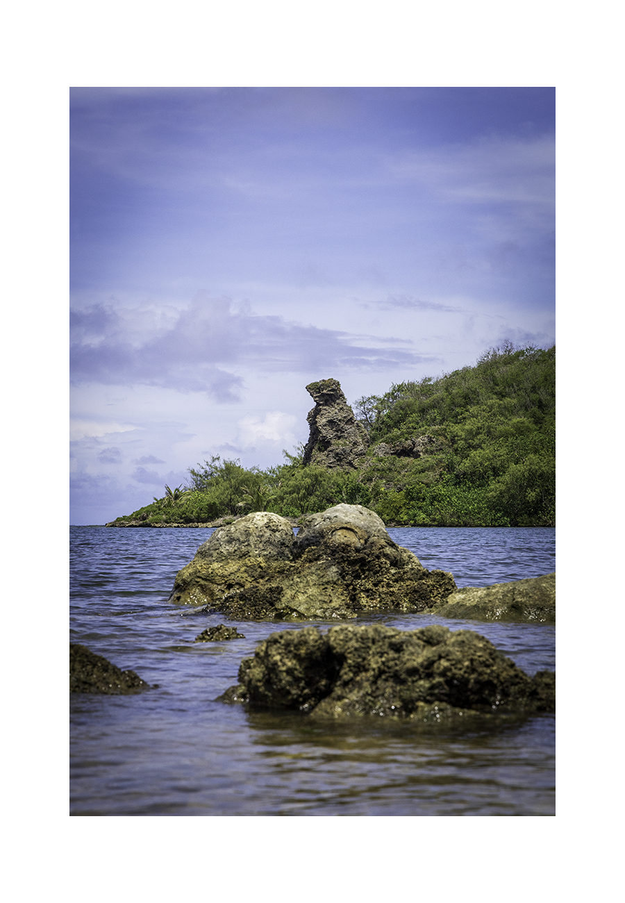 An 8x12 inch fine art coastal photography print of Bear Rock in Guam, showing product dimensions and clean white border margins.