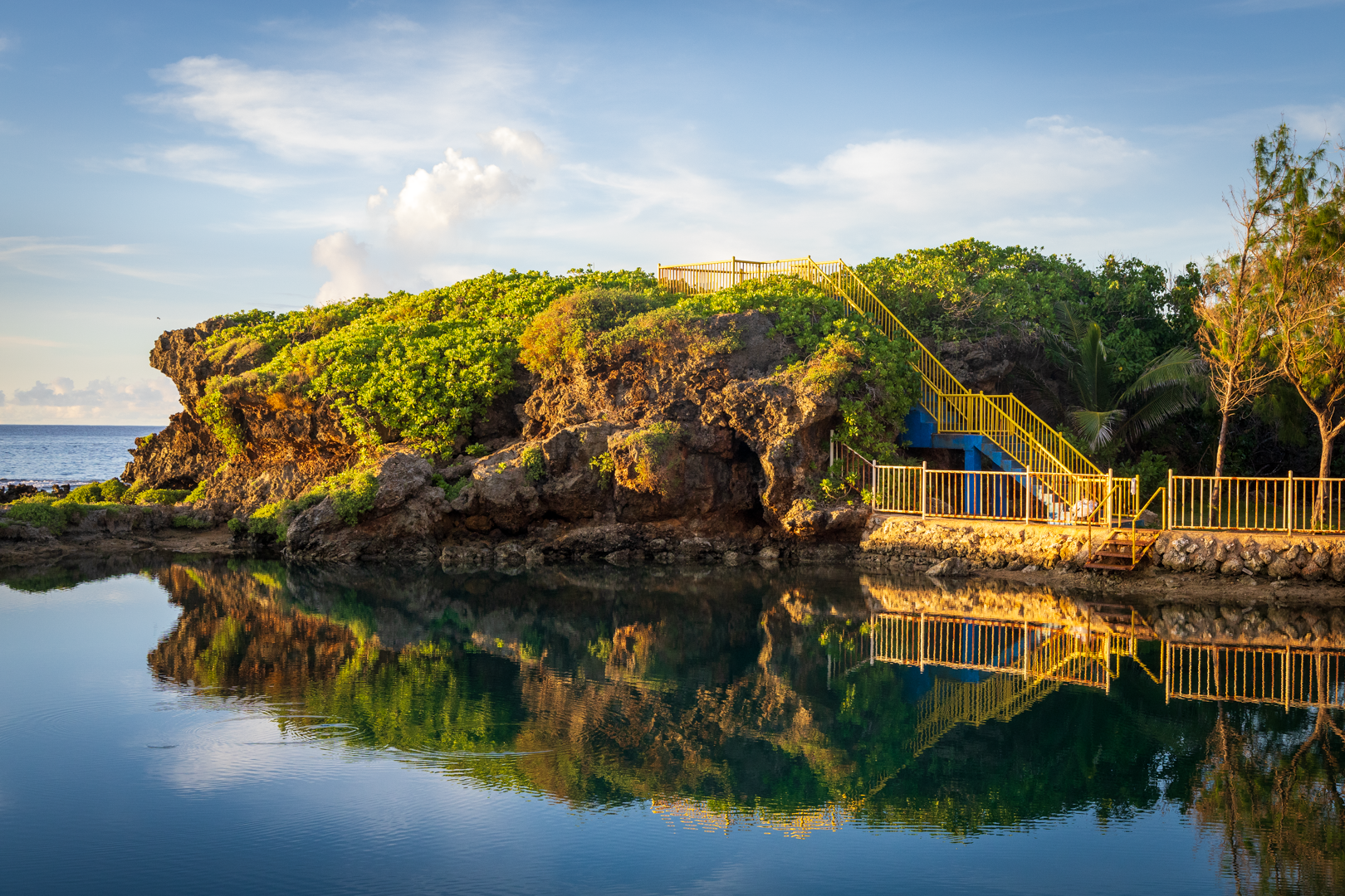 Rugged east coast landscape of Inalåjan, Guam, capturing the quiet solitude and natural rock formations of the shoreline. 