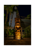 An 8x12 inch fine art travel print of an illuminated tiki totem in Guam, showing product dimensions and clean white border margins.