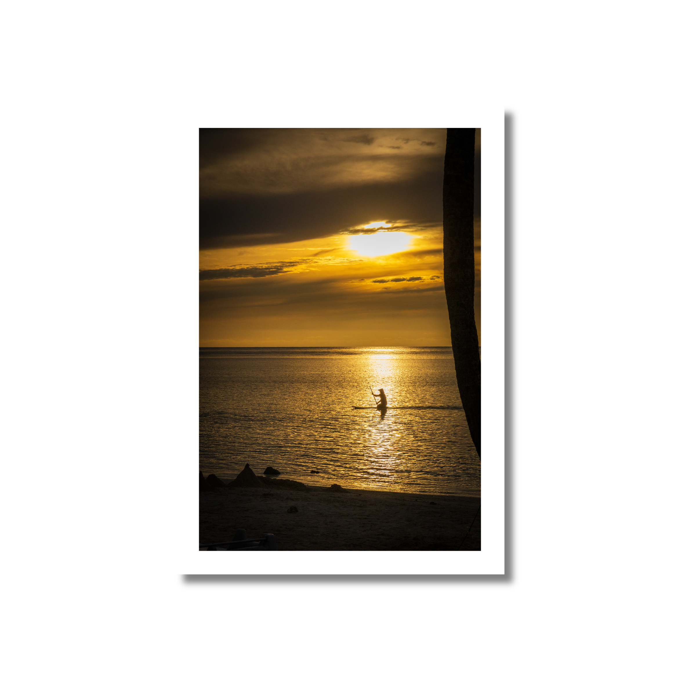 Vibrant golden sunset with dramatic clouds reflecting on calm water, featuring a silhouette of a lone paddleboarder in the distance.