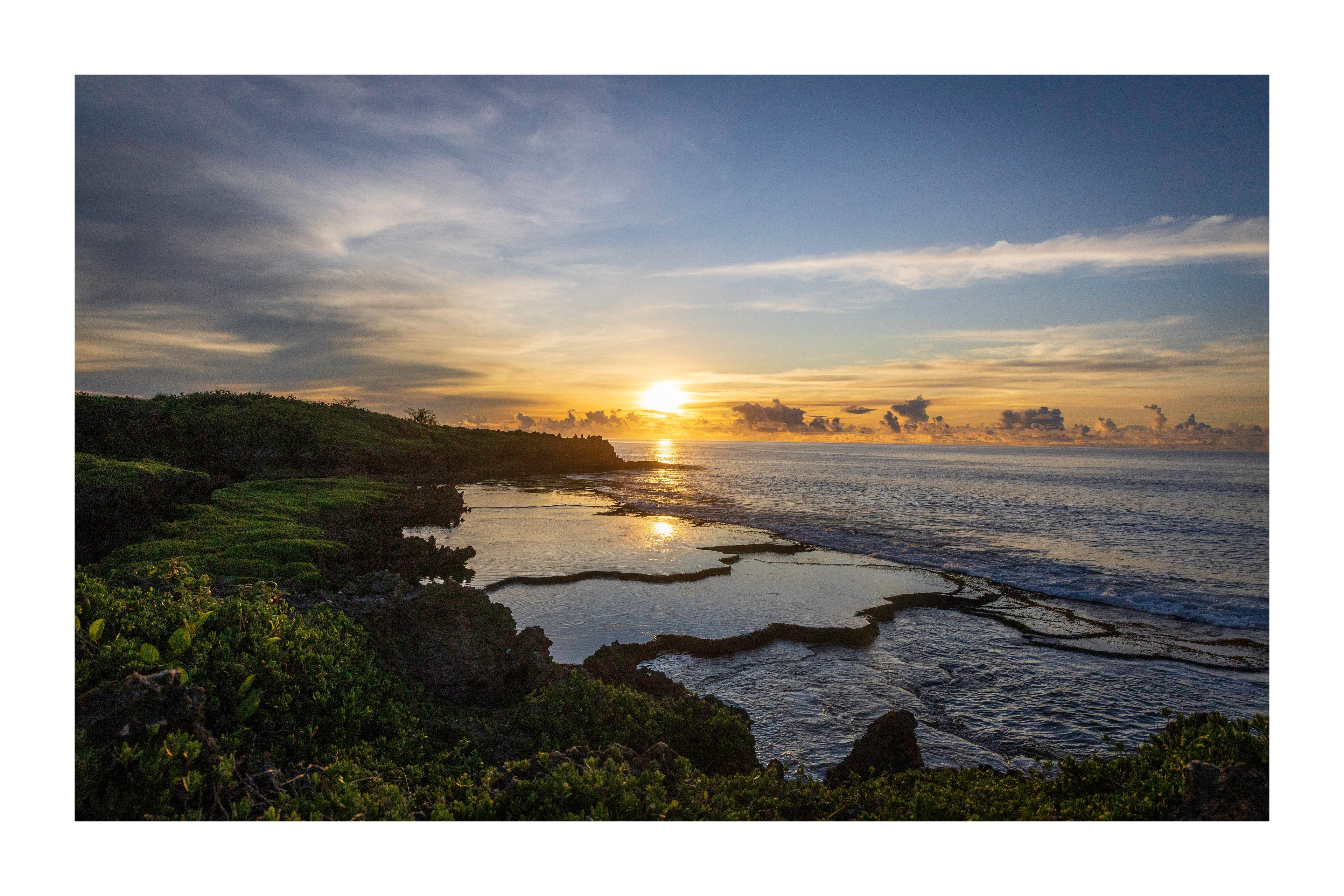 A 18x12 inch fine art print of the Inalåjan sunrise in Guam, showing the product dimensions and symmetrical white border margins.