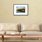 An Inalåjan Natural Pools print in a sleek frame, styled on a living room wall above a contemporary couch.